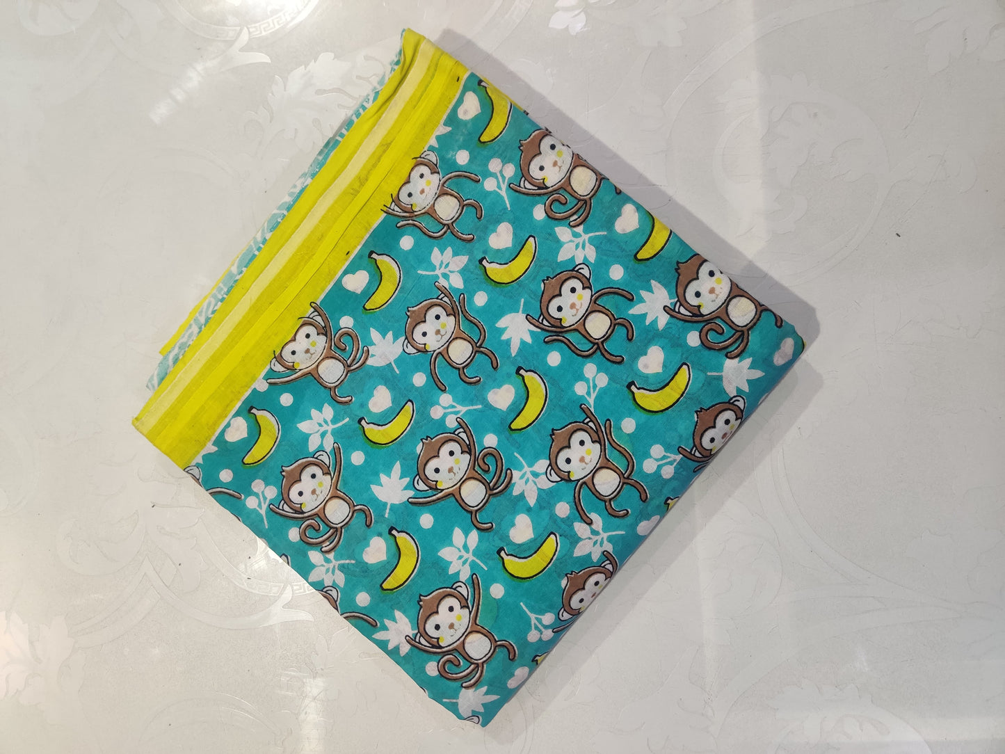 Organic Soft Cotton- Go bananas with this playful monkey pattern saree